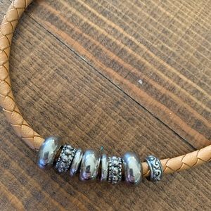 Necklace ~ silver slide beads on a tan southwestern Rope.